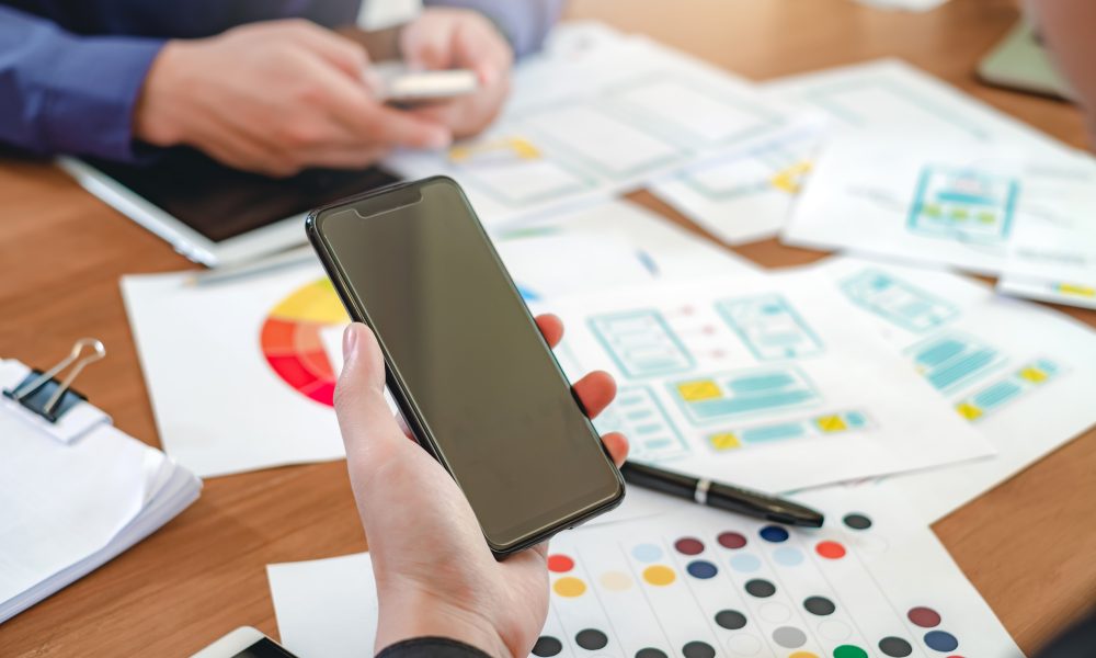 Creative web designers and applications work together in the office.